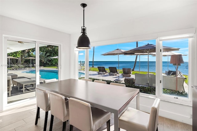 520 S Mashta Dr, Key Biscayne, FL 33149 - dining area featuring a water view and wood finished floors