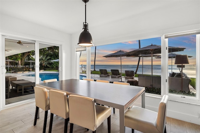 520 S Mashta Dr, Key Biscayne, FL 33149 - dining room featuring light wood-type flooring and a water view