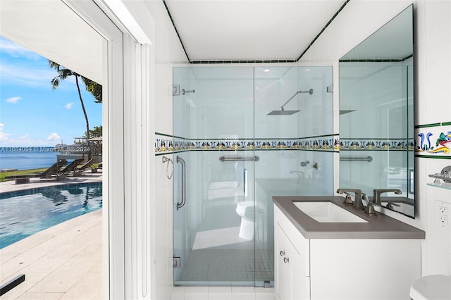 520 S Mashta Dr, Key Biscayne, FL 33149 - full bathroom with toilet, vanity, a stall shower, and a water view