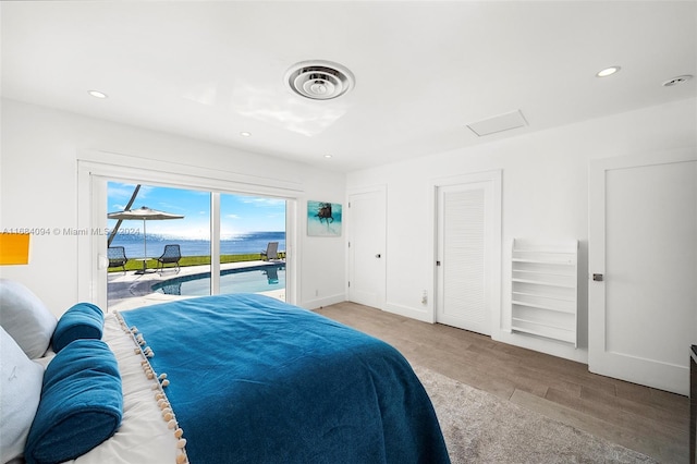 520 S Mashta Dr, Key Biscayne, FL 33149 - bedroom with access to outside, recessed lighting, attic access, baseboards, and wood finished floors