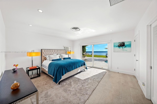 520 S Mashta Dr, Key Biscayne, FL 33149 - bedroom featuring access to exterior, wood finished floors, a water view, recessed lighting, and baseboards