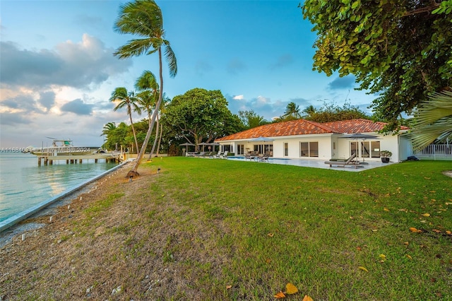 520 S Mashta Dr, Key Biscayne, FL 33149 - view of grassy yard featuring a patio and a water view