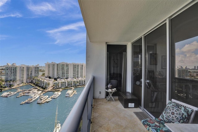 balcony featuring a water view