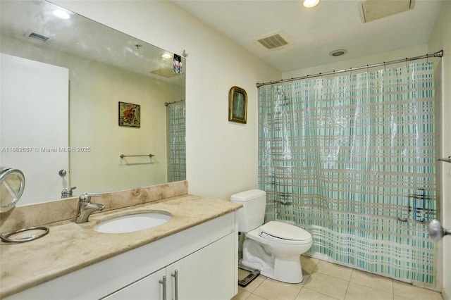 bathroom featuring tile patterned floors, vanity, a shower with shower curtain, and toilet