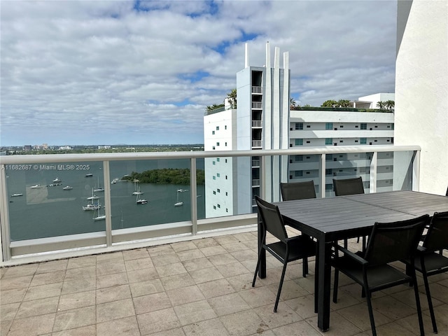 balcony featuring a water view