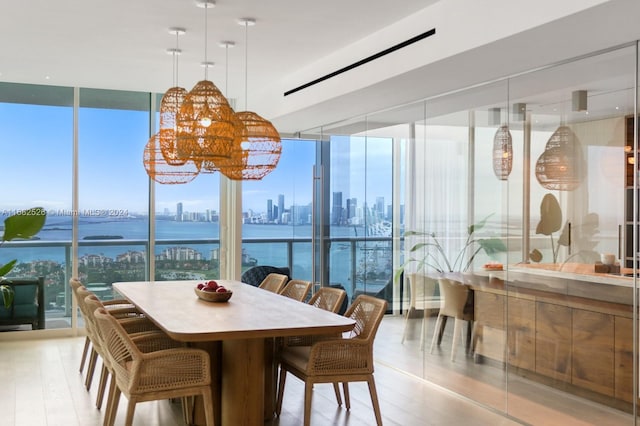 sunroom / solarium featuring a water view