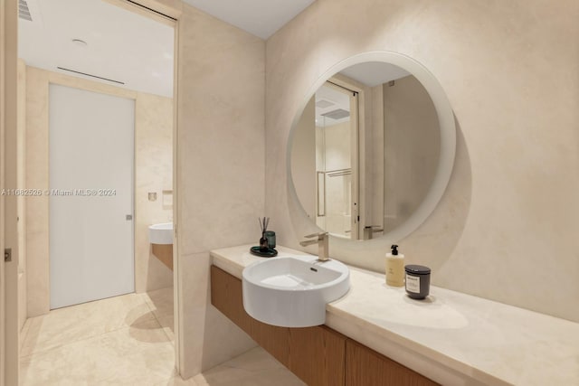 bathroom with vanity and tile patterned floors