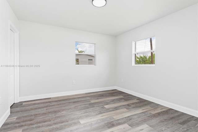 spare room featuring hardwood / wood-style flooring