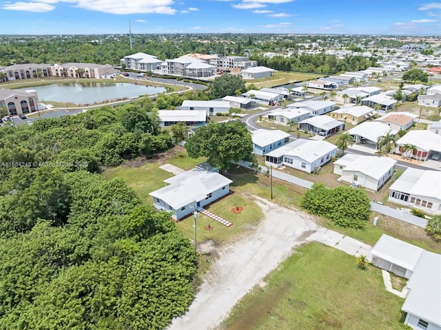 aerial view featuring a residential view and a water view