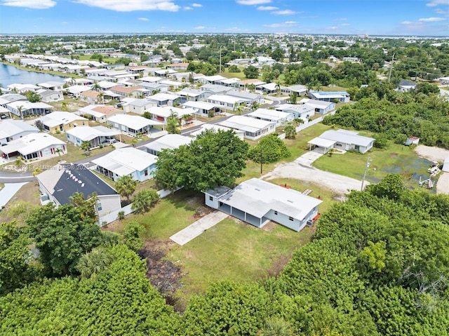 birds eye view of property featuring a residential view and a water view