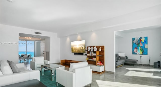 living room featuring concrete flooring