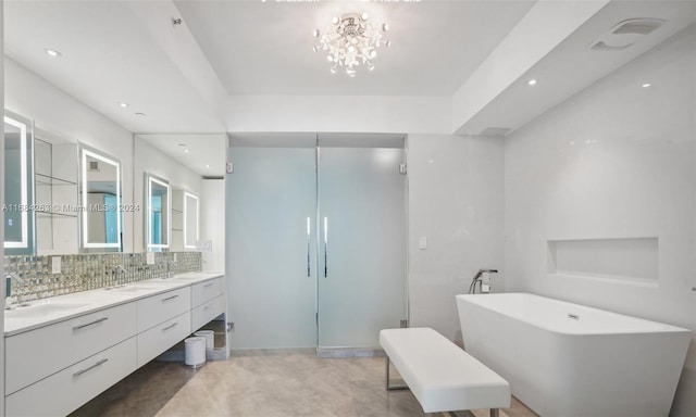 bathroom with tasteful backsplash, a bathtub, and vanity