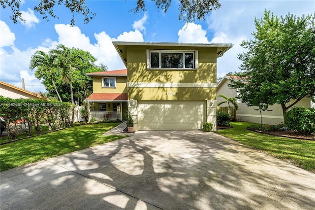 view of front of home featuring a front yard and a garage