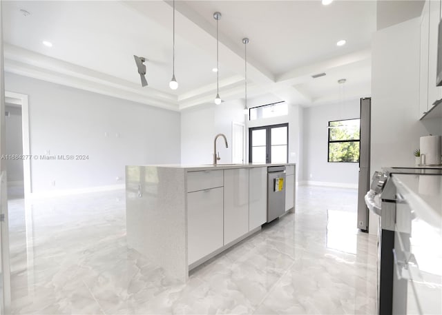 kitchen featuring white cabinetry, stainless steel appliances, a kitchen island with sink, and hanging light fixtures