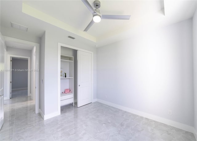 unfurnished bedroom featuring a closet and ceiling fan