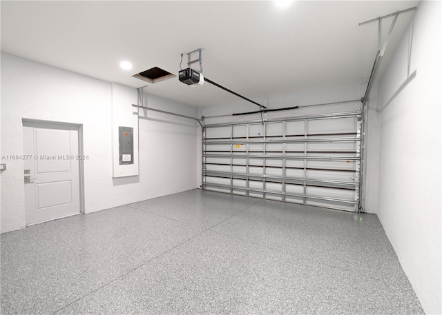 garage featuring a garage door opener and electric panel