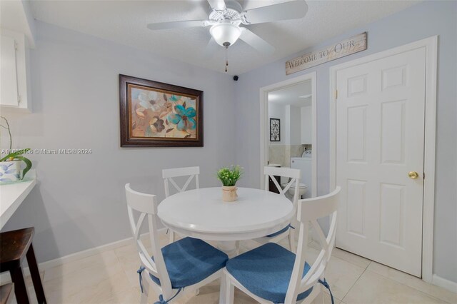 dining area with light tile patterned flooring and ceiling fan