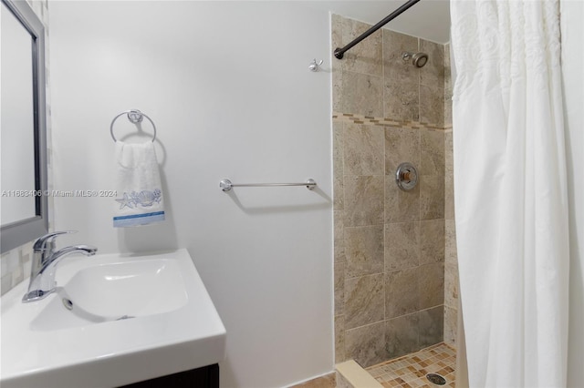 bathroom with vanity and curtained shower