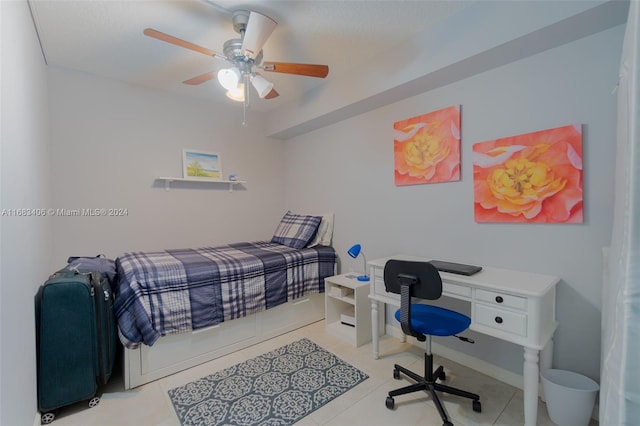 bedroom featuring light tile patterned floors and ceiling fan