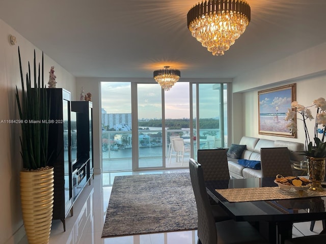 living room with a water view and a chandelier