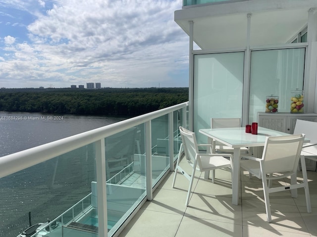 balcony featuring a water view