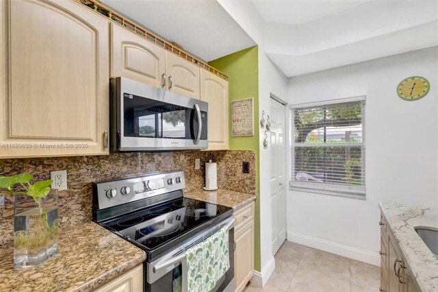 bathroom featuring vanity, tile patterned floors, and a textured ceiling