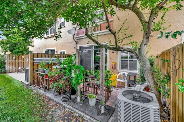 exterior space featuring a patio area and central AC