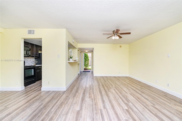 unfurnished living room featuring light hardwood / wood-style floors, a textured ceiling, and ceiling fan