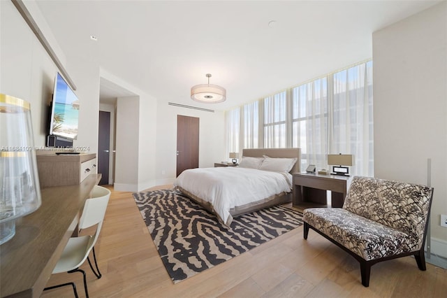 bedroom with light hardwood / wood-style floors