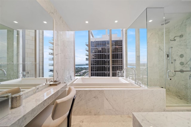 bathroom featuring separate shower and tub