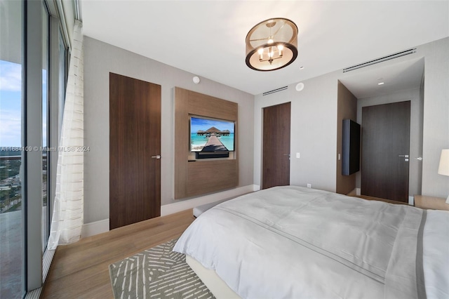 bedroom with hardwood / wood-style flooring