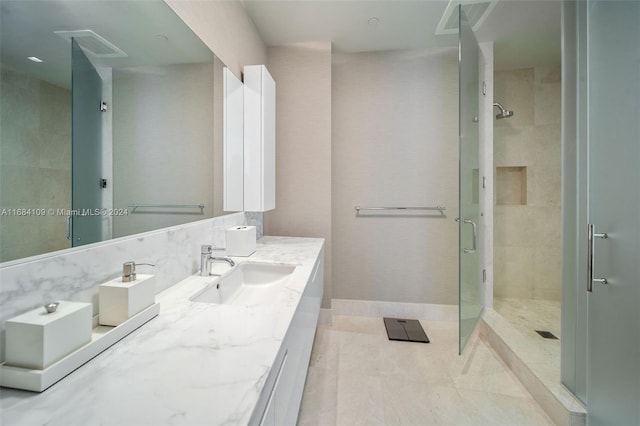 bathroom with vanity and an enclosed shower