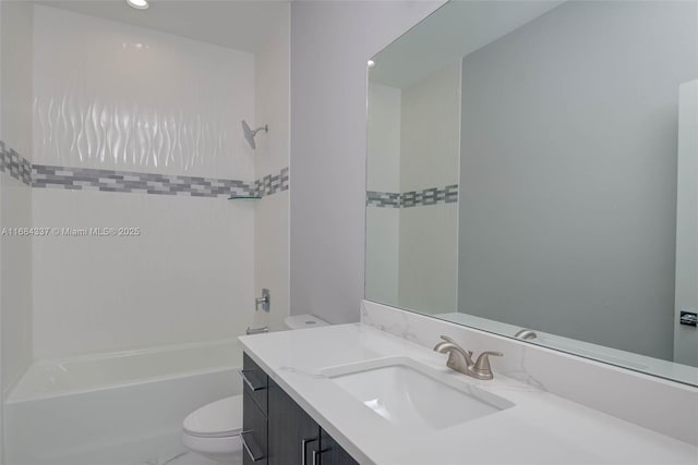 full bathroom featuring tiled shower / bath combo, toilet, and vanity