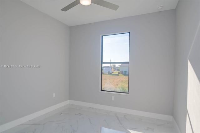 spare room with ceiling fan