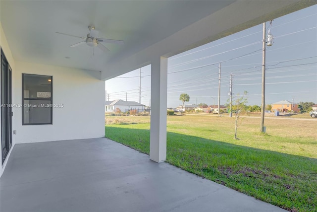 view of patio featuring ceiling fan