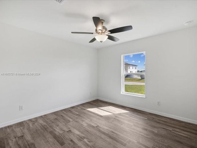 unfurnished room with hardwood / wood-style floors and ceiling fan