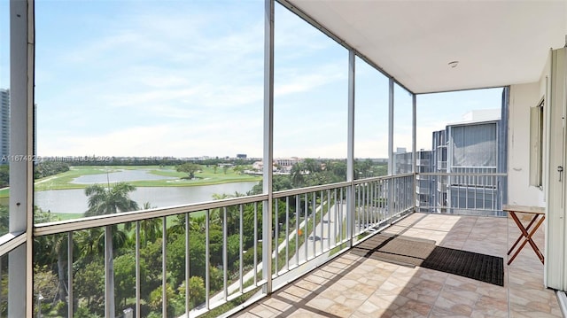 unfurnished sunroom with a water view