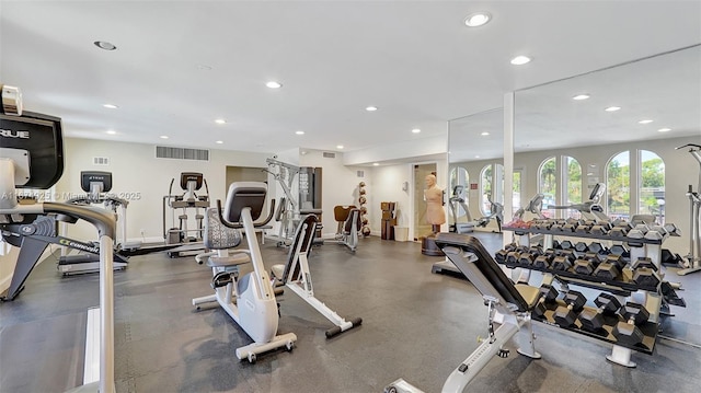 workout area featuring visible vents and recessed lighting