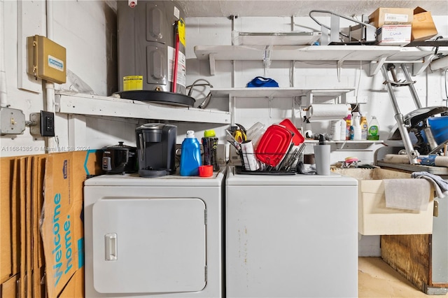 laundry area with electric water heater and washing machine and dryer