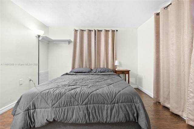 bedroom featuring dark hardwood / wood-style floors