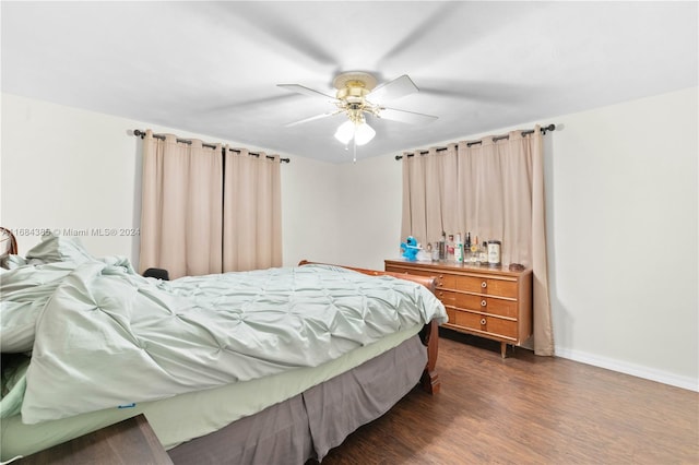 bedroom featuring dark wood-type flooring and ceiling fan