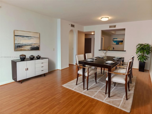 dining area featuring light wood-type flooring