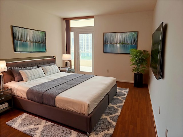 bedroom with dark wood-type flooring