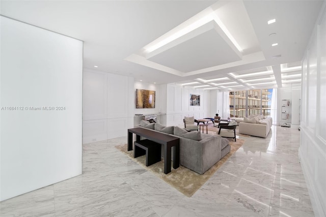 living room with coffered ceiling