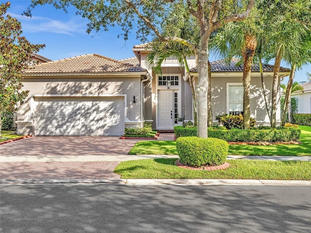 mediterranean / spanish-style home featuring a garage