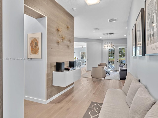 living room featuring wooden walls and wood-type flooring