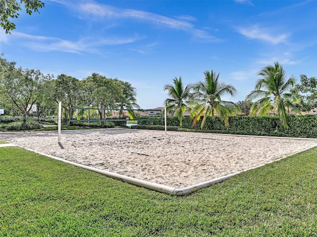 view of home's community featuring a yard and volleyball court