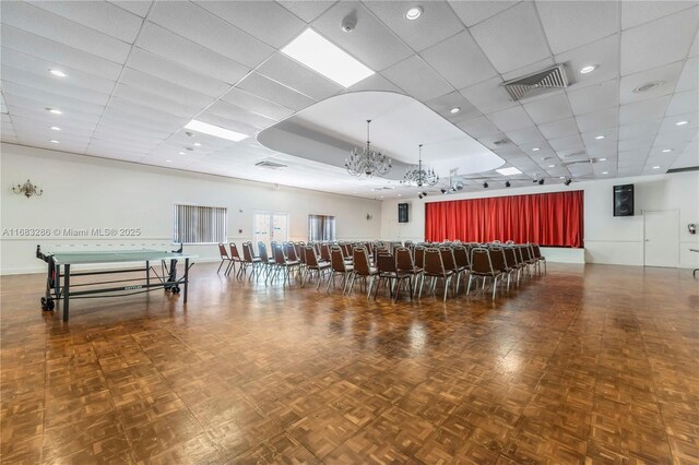 recreation room with french doors and dark parquet floors