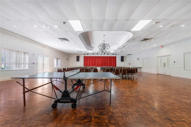 exercise room featuring a paneled ceiling