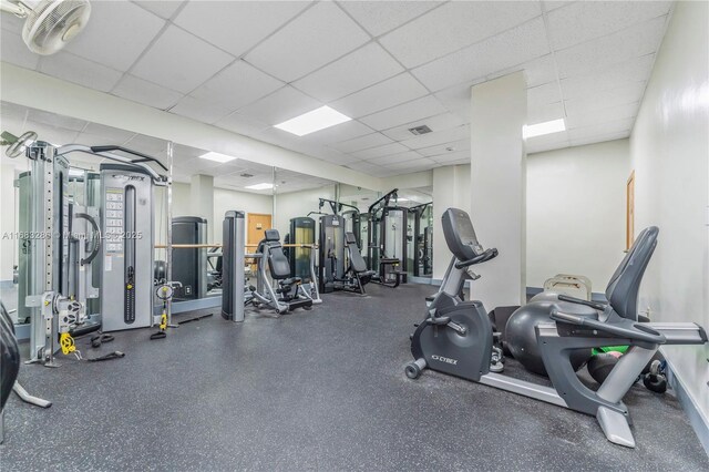 exercise room with a drop ceiling